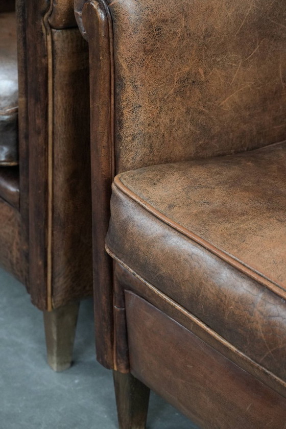 Image 1 of 2 x Vintage sheepskin armchair with warm colours and a characterful appearance