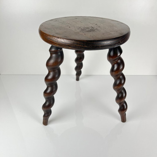 Antique solid wood stool with twisted legs, early 20th century