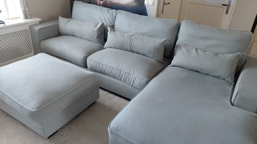 Lounge sofa with footstool