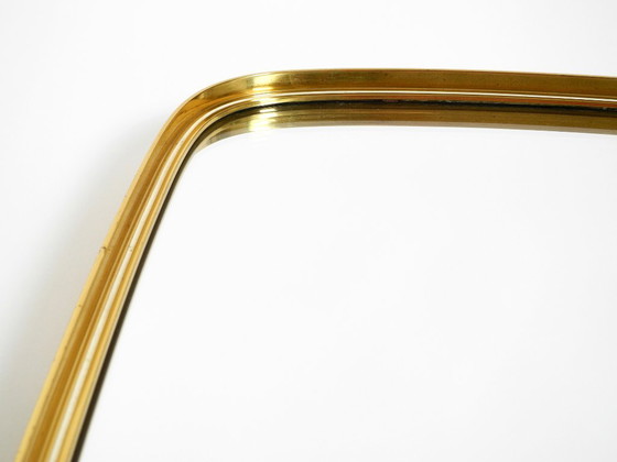 Image 1 of A pair of rare original Mid Century Modern "Münchener Zierspiegel" wall mirrors with heavy brass frames