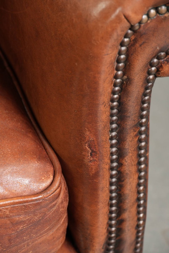 Comfortabele vintage schapenleren armchair afgewerkt met siernagels – Fauteuils, Leather, Klassiek (photo 10 of 12)