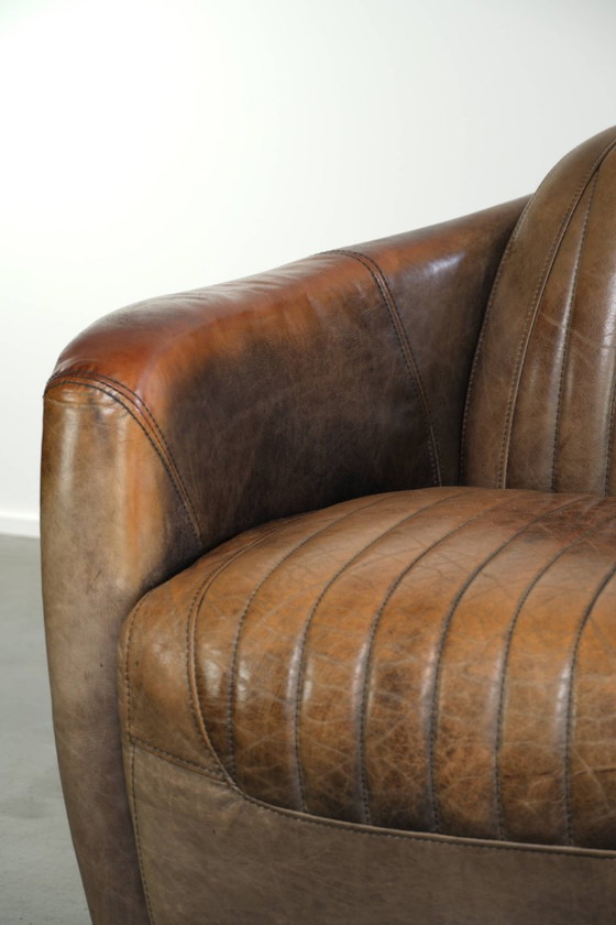 Robuster und charaktervoller Aviator Design Clubsessel aus Rindsleder mit einzigartiger Aluminiumoberfläche (photo 9 of 12)