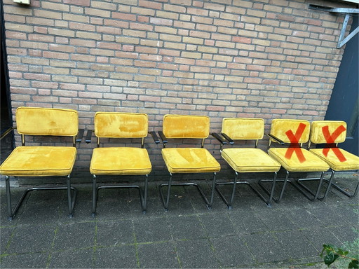 4 sedie in tessuto a coste gialle con struttura tubolare cromata