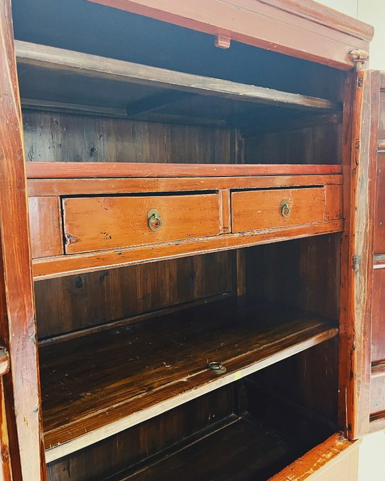Image 1 of Antique red cabinet with brass details