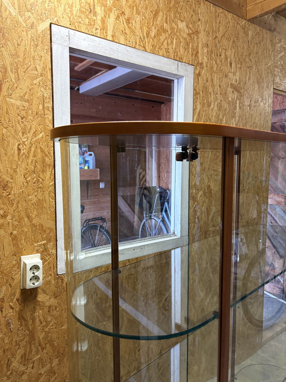 Image 1 of Vintage Fiam Italia oval cherry wood and glass display cabinet