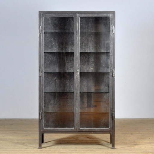 Polished iron medical cabinet, 1930s
