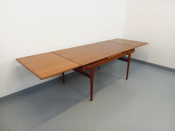 Image 1 of Vintage Scandinavian rectangular dining table by Ejvind A. Johansson from the 50s and 60s in teak with integrated extensions