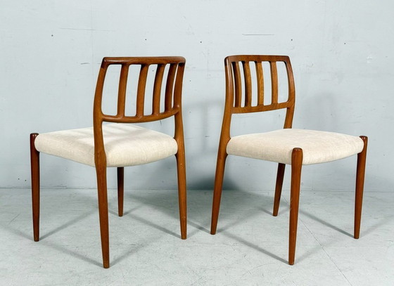 Image 1 of JL Møllers, ensemble de 4 chaises de salle à manger, modèle '83', teck, laine, années 1960, Danemark (4)