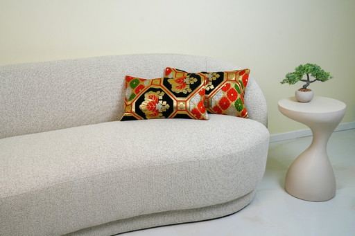 Het Kikkō Royal lendenkussen: geometrische zwarte en gouden zijde