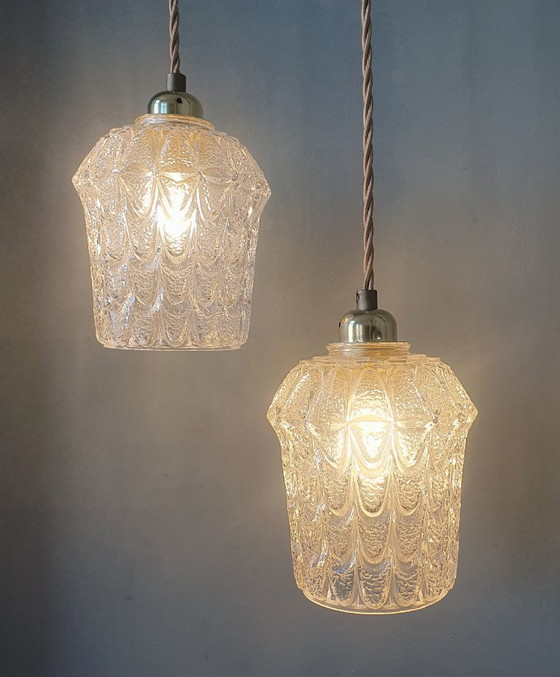 Image 1 of Set of two vintage Mic Century pendant lamps of thick, textured glass.