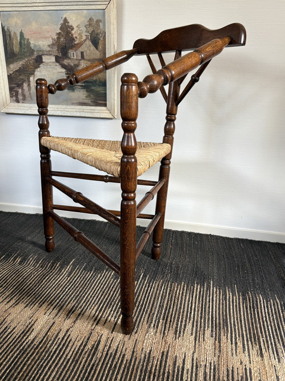 Image 1 of  Vintage Antiek 20ste eeuw eiken hoekstoel met biezen zitting h85cm