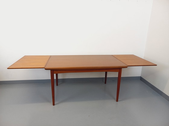 Image 1 of Scandinavian 60's vintage Dyrlund rectangular teak dining table with extensions