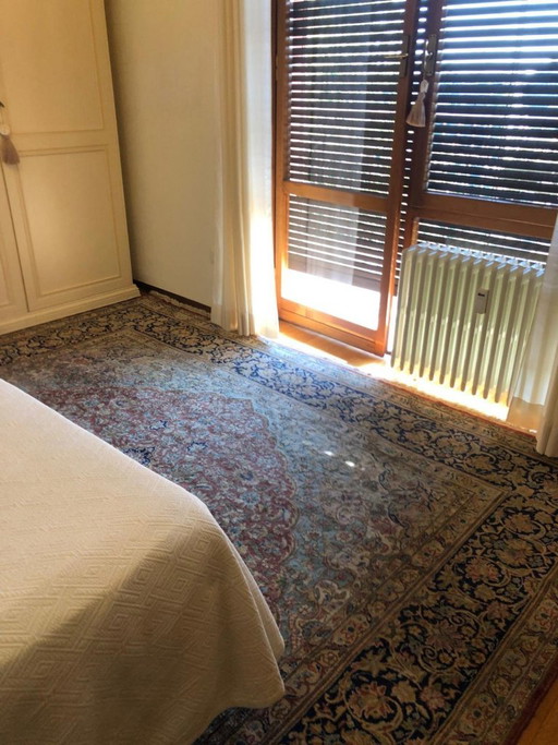 Alfombra persa Kirman anudada a mano 404 × 297 cm con certificado
