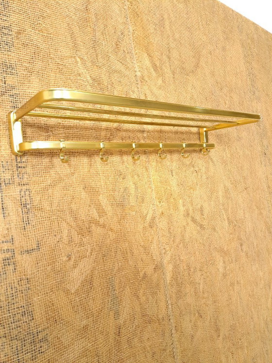 Image 1 of Porte-manteau en forme de train, couleur or, avec crochets, n° 18