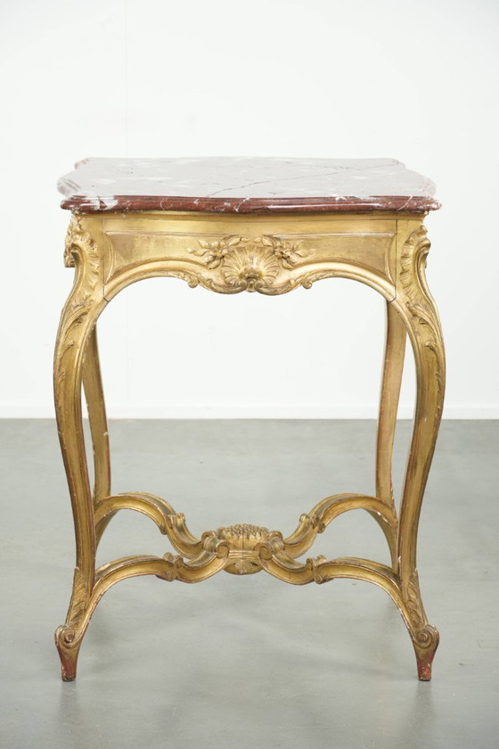 Image 1 of Antique French side table/center table from the 19th century with a gold-colored wooden frame and an original marble tabletop.