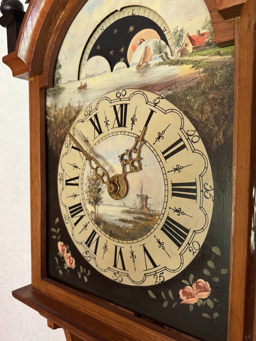 Large Frisian tail clock 150 cm due to moving. Works perfectly.