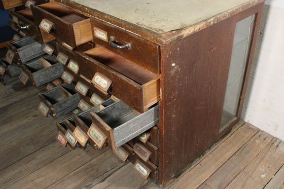 Image 1 of Antique industrial apothecary cabinet • Vintage wood and metal drawer cabinet with many compartments
