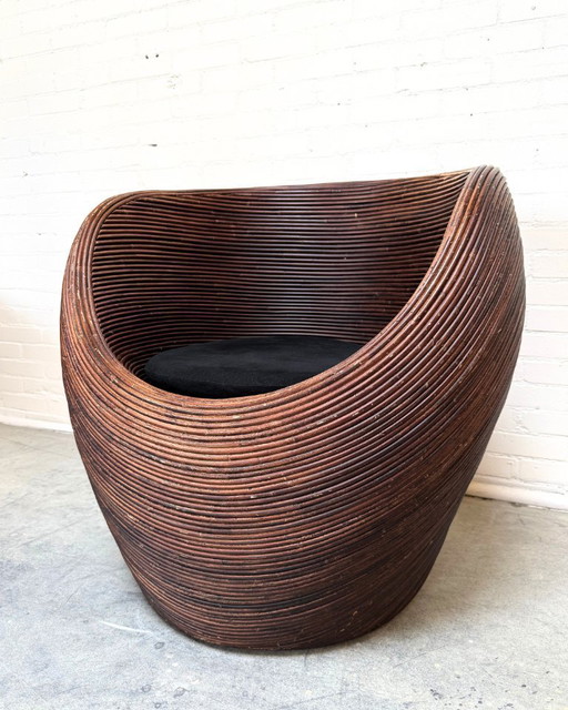 Sillón de ratán orgánico atribuido a Gabriella Crespi