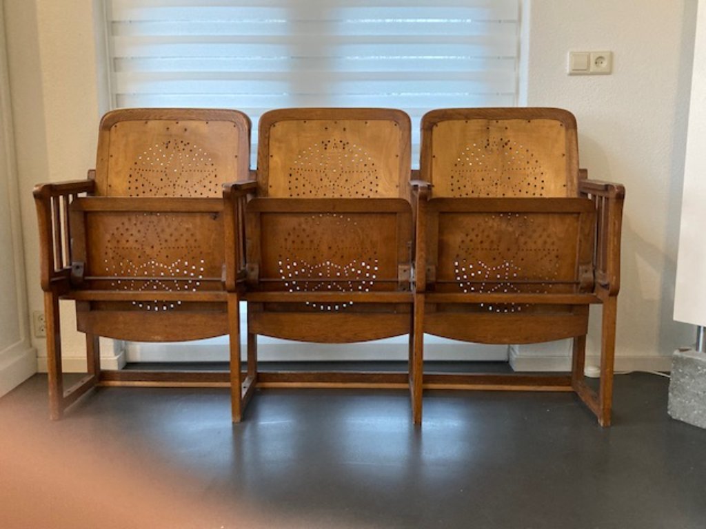 3 auction chairs with folding table on the back