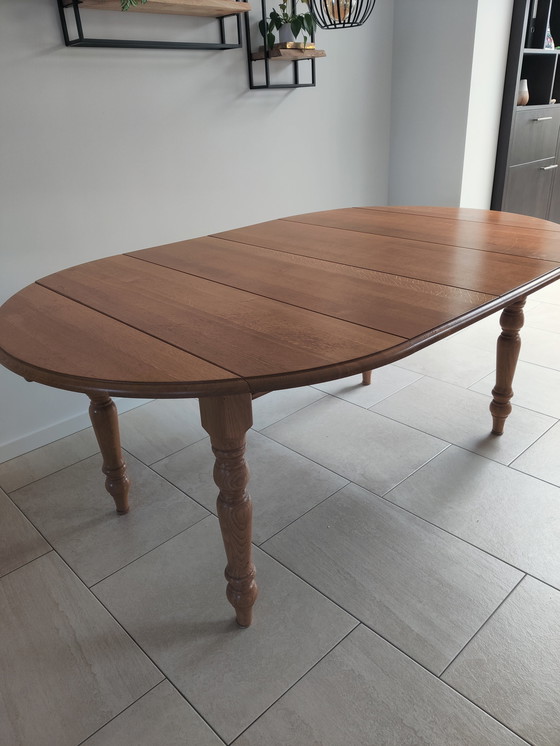 Image 1 of In large adjustable oak table