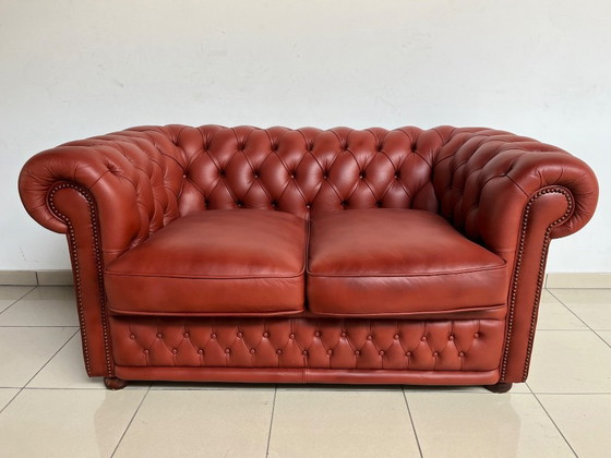 Image 1 of English Chesterfield Sofa Pair – Paprika Red Leather (Fully Restored, Rare Colour)
