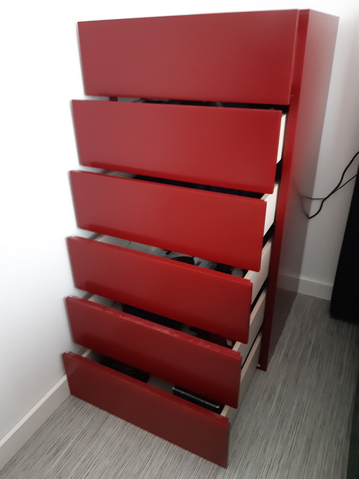 Two sleek, ruby red, designer chest of drawers
