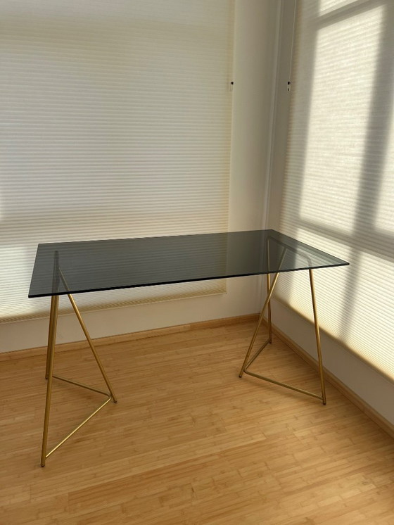 Image 1 of MADE  black smokey glass desk with golden metal legs