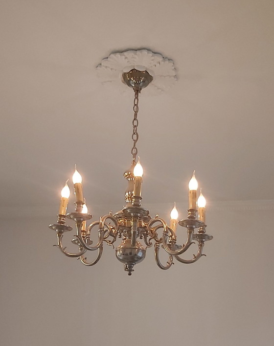 Image 1 of beautiful lusters bronze with silver
patinated.
MOD DEP LAMP ART
12 arms and 8 arms.
