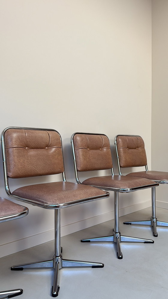 Image 1 of Four vintage chrome swivel chairs with faux leather