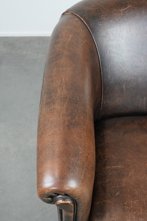 Image 1 of Sturdy and characterful vintage sheepskin club armchair