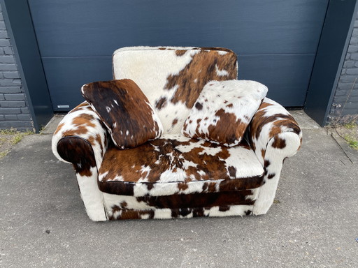 Alfred P baxter fauteuil koeienhuid 