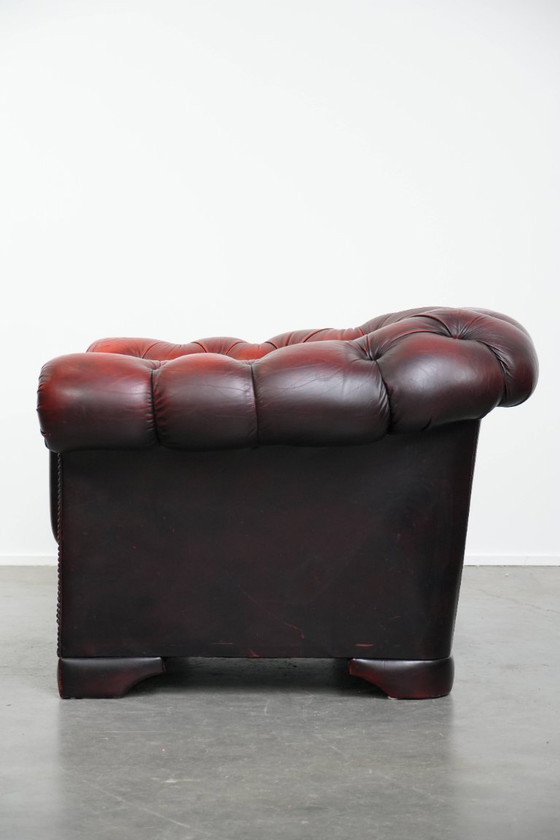 Image 1 of Rode rundleren chesterfield buttonseat fauteuil
