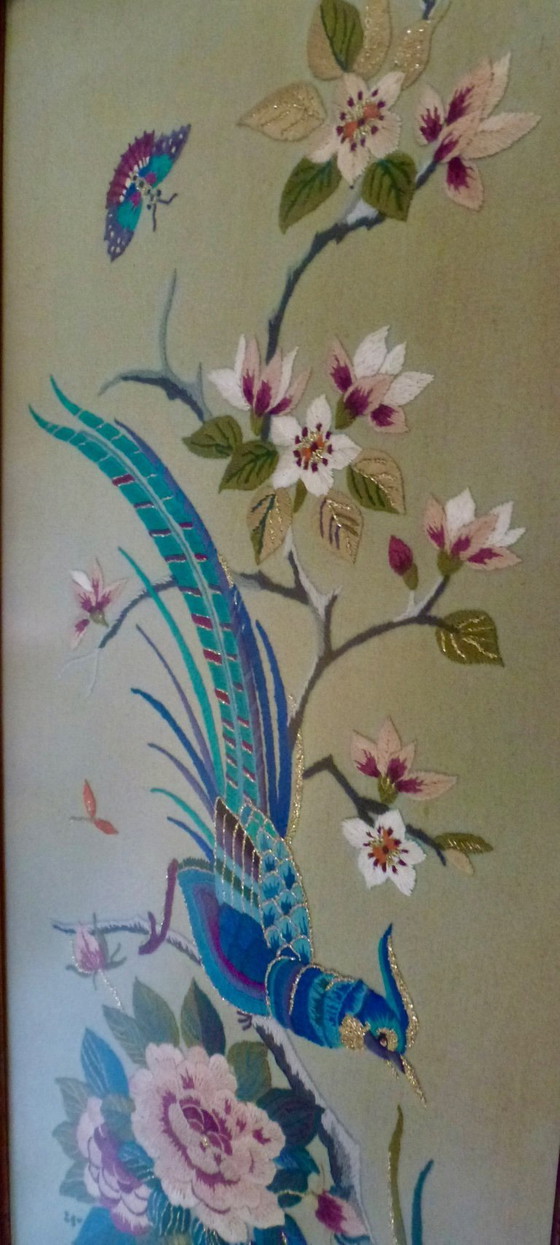 Image 1 of Vintage hand-embroidered wall tapestry, behind glass, with a crane, butterflies and flowers.