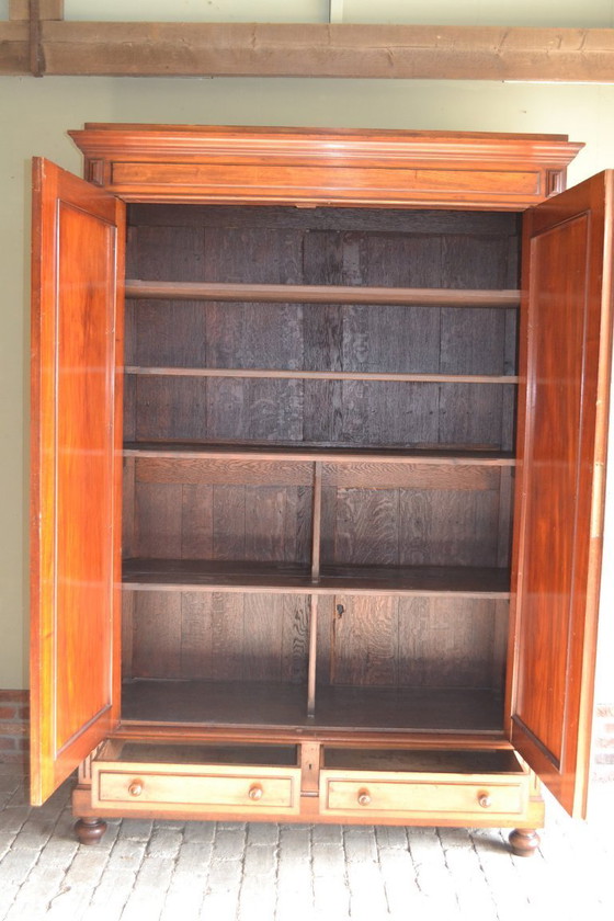 Image 1 of Sleek antique mahogany cabinet.