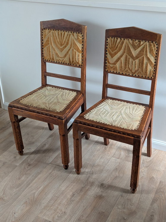 Image 1 of Een paar art-deco eetkamerstoelen van de Amsterdamse School – eikenhout en velours (jaren 1920/1930)