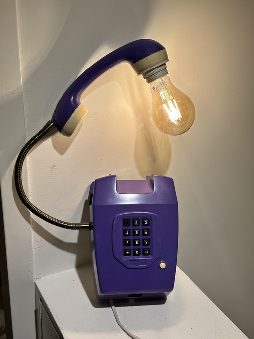 Vintage purple hang-up telephone