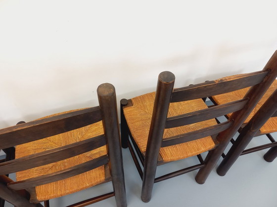 Image 1 of Set van 4 vintage brutalistische stoelen van Georges Robert, gemaakt van hout en stro, uit de jaren 50 en 60.