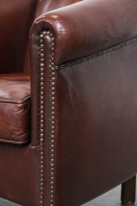 Image 1 of Vintage schapenleren clubfauteuil met siernagels
