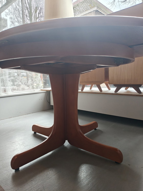 Image 1 of Extendable round to oval dining table