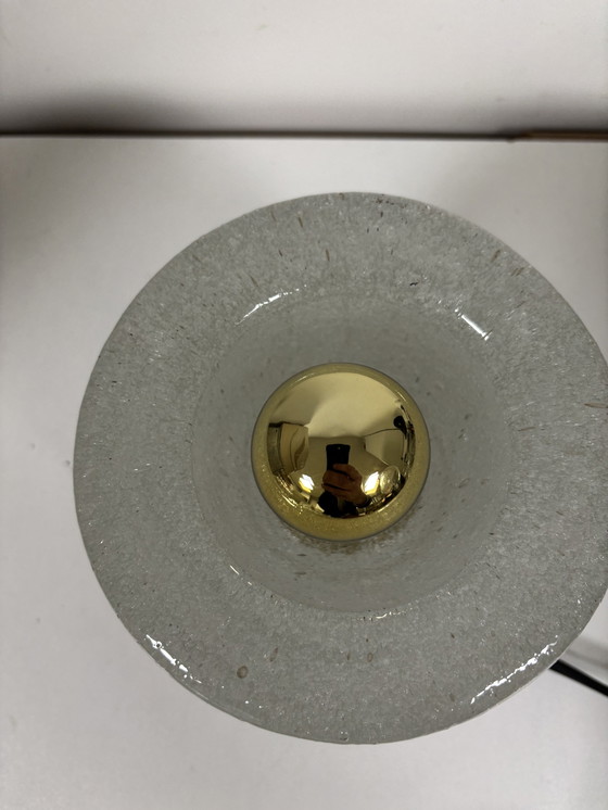 Image 1 of vintage table lamp by Peill & Putzler is made of thick ice glass with brass details