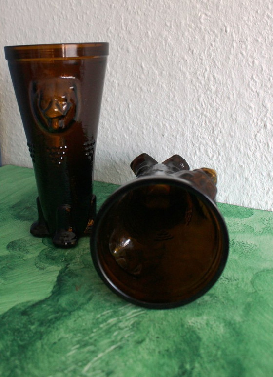 Image 1 of Antique wine tankard made of heavy amber glass with lion heads and paws