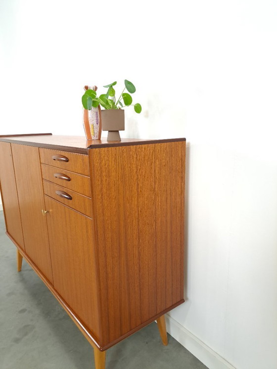 Image 1 of Armadio in teak con gambe inclinate e cassetti dalla Svezia