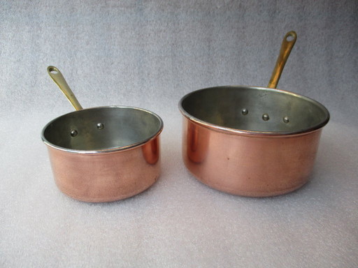 Copper saucepans, set of two, marked made in Portugal, 1980.