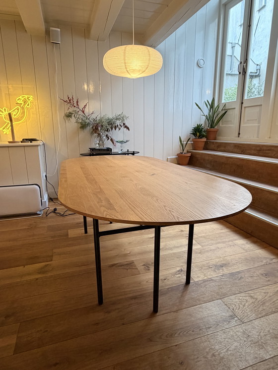 Image 1 of Menu Snaregade Oval Table Oak with black metal base