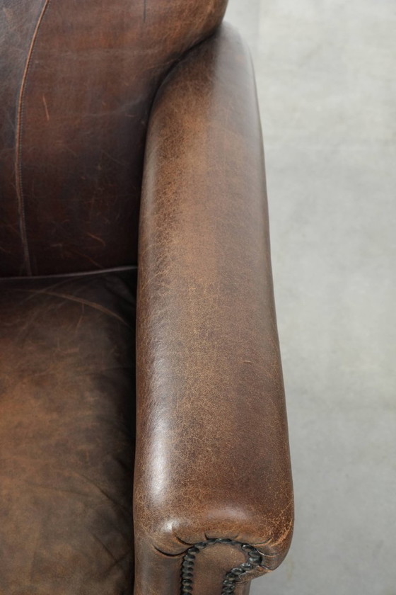 Image 1 of 2 fauteuils design en peau de mouton avec une belle patine