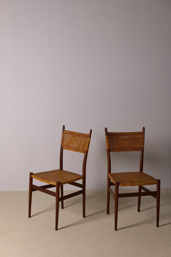 Image 1 of Set van 4 Italiaanse eetkamerstoelen van teakhout en rotan.