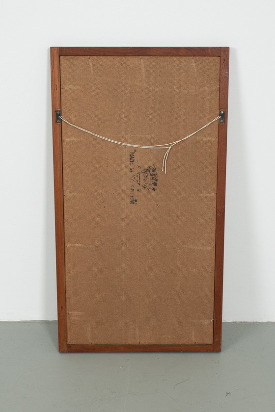 Image 1 of Aksel Kjersgaard in front of Odder Møbler mirror