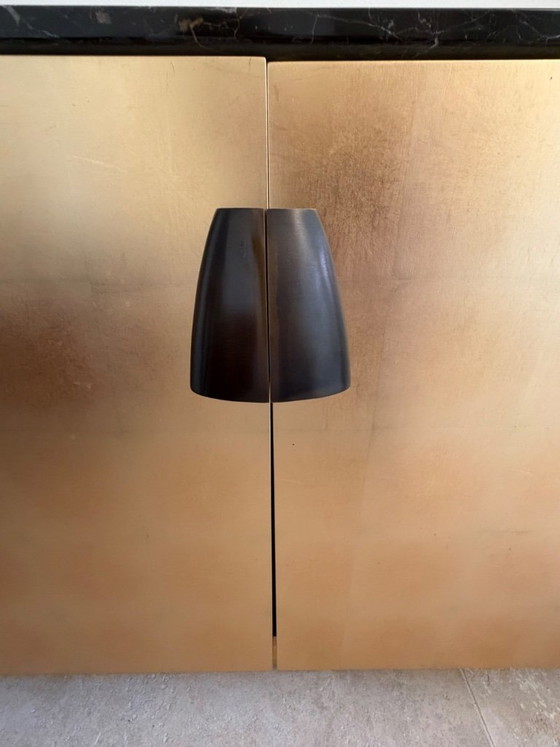 Image 1 of Cassettiera/Comò in foglia d'oro con piano in marmo Saint Laurent