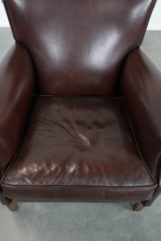 Image 1 of Donkere luxe schapenleren fauteuil/ armchair met een tijdloze uitstraling