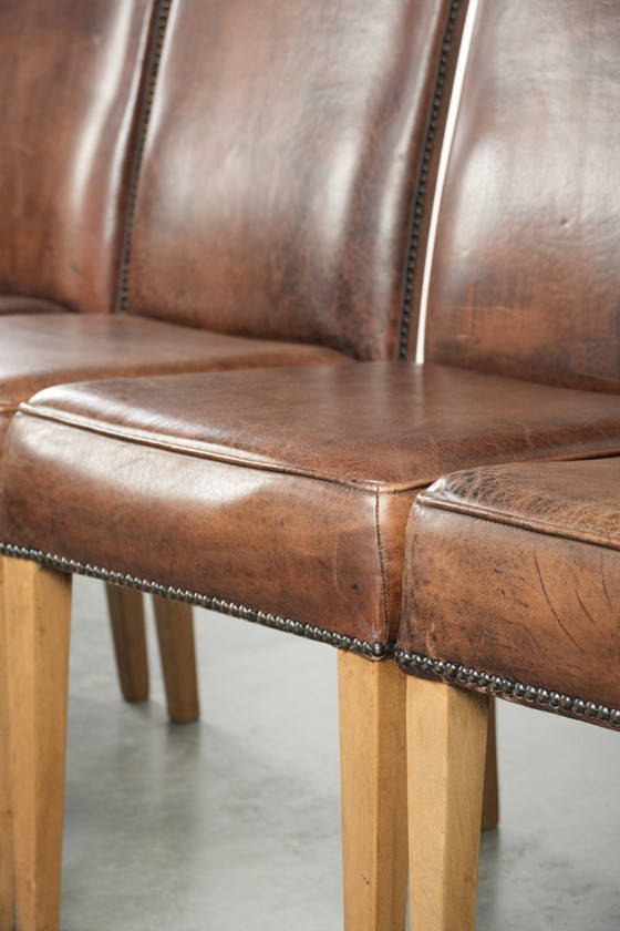 Image 1 of 4 x Vintage eetkamerstoel gemaakt van schapenleer met een hoge rug